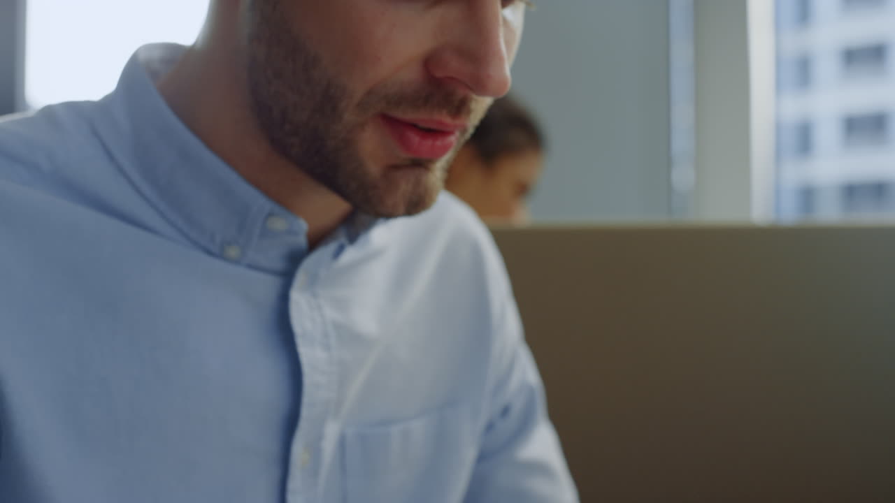 Executive making report on laptop