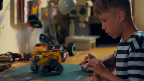 boy building a robot toy