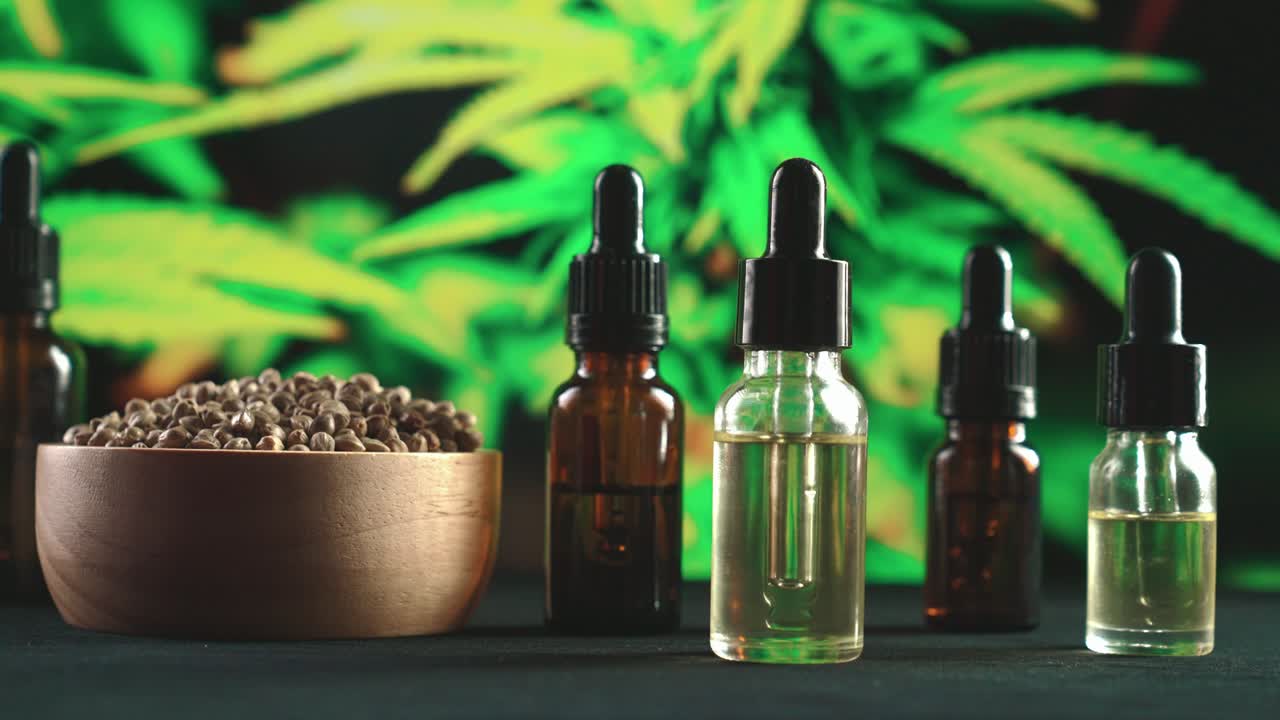 Set of legalized product extracted from cannabis plants on table for copyspace.