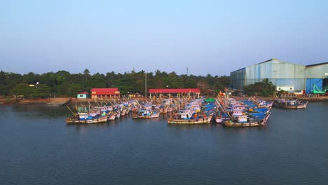 Boatyard-with-fishing-boats-in-the-backwaters-of-Udupi,-Karnataka,-India