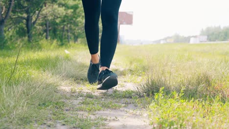 cu low-angle shot young girl goes in for sports in the morning