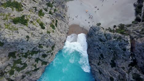 top down view of sa calobra, majorca - mediterranean sea holiday - beach with tourists