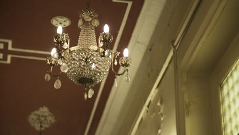 luxury old chandelier in an old mansion with camera movement 5