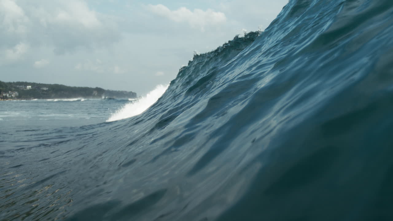 Blue green water surges in slow motion with smooth textures ideal for abstract visuals