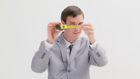 Businessman-holding-a-measuring-tape