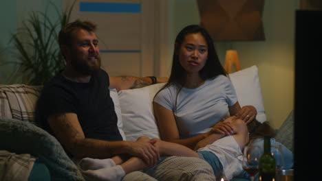 family watching tv at home