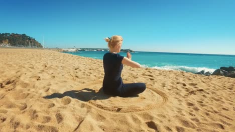 fit girl practicing yoga outdoors at sunny day. young woman meditating