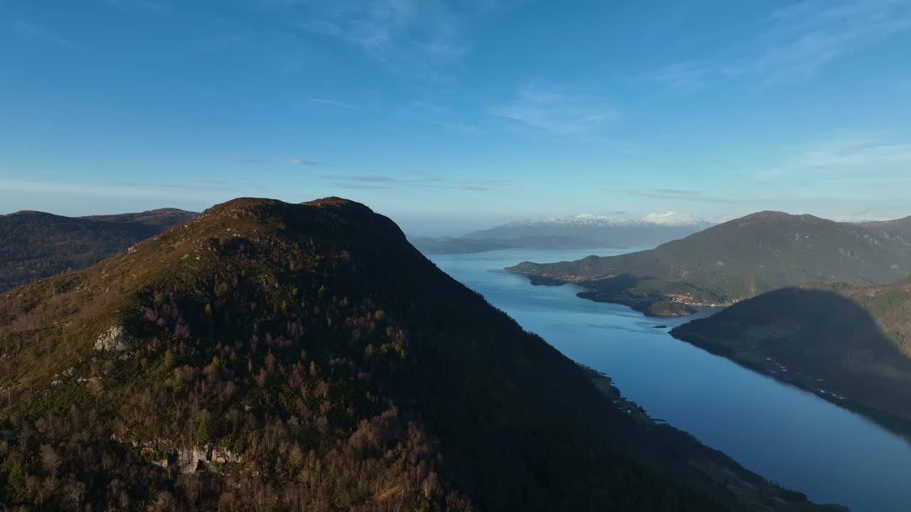 Scenic aerial view from Vindafjord Norway, looking north towards Olsfjorden and Etnefjord. Sunset colors over Katanuten mountain and coastline