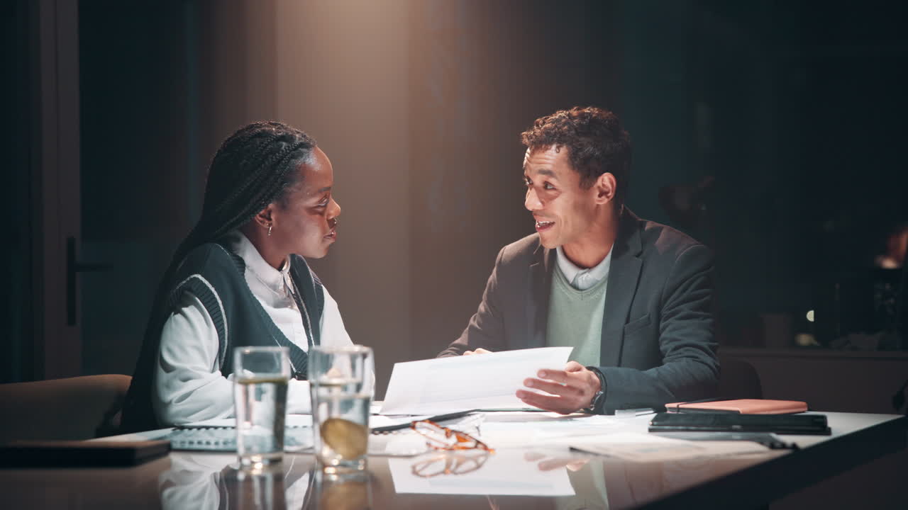 Two colleagues discussing business in a meeting