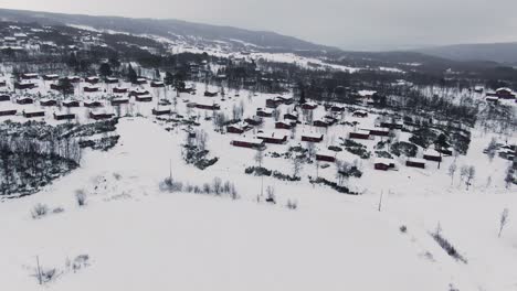 panoramic orbiting aerial over rural area in snowy winter landscape