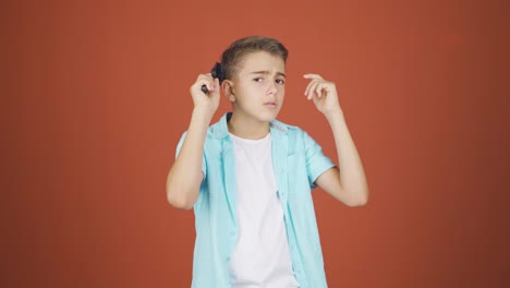 Boy-combing-his-hair.