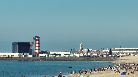 long lens drone shot of the large concert at sea festival at the brouwersdam, the netherlands