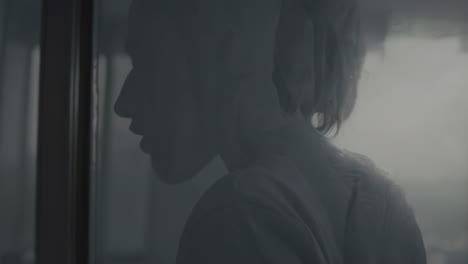 silhouette of a woman in a foggy room