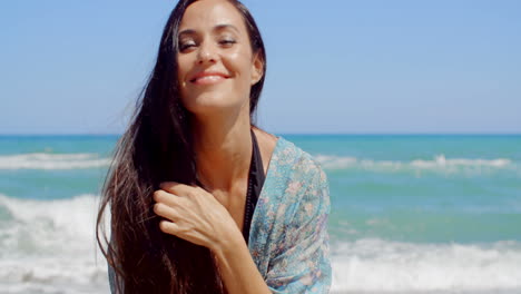 Happy-Woman-at-the-Beach-Looking-at-Camera