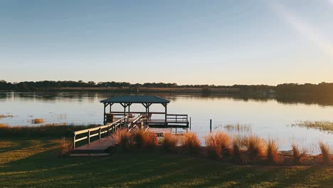 serene lakeside pavilion at sunrise/sunset