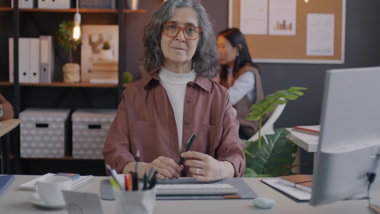 Senior Woman Working in Modern Office