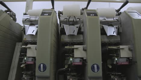 spinning machine processing cotton into thread in a industrial mill