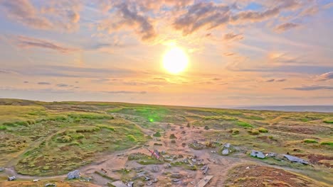 drone footage of a b29 aircraft crash site showing the us flags in a sunset background, now serving as a us memorial. located on devils dike trail, glossop, peak district, uk