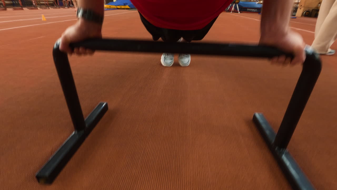 Person training with fitness equipment in a gym