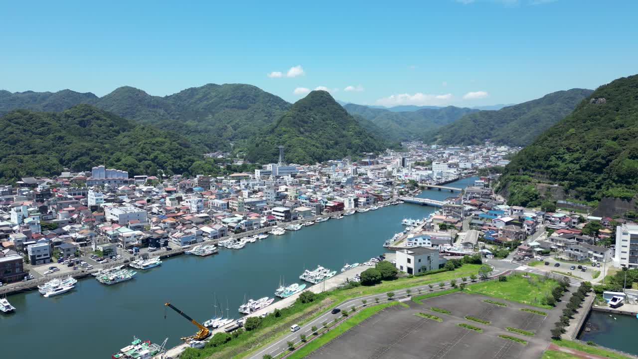 High above drone shot above Shimoda city in Japan on sunny summer day