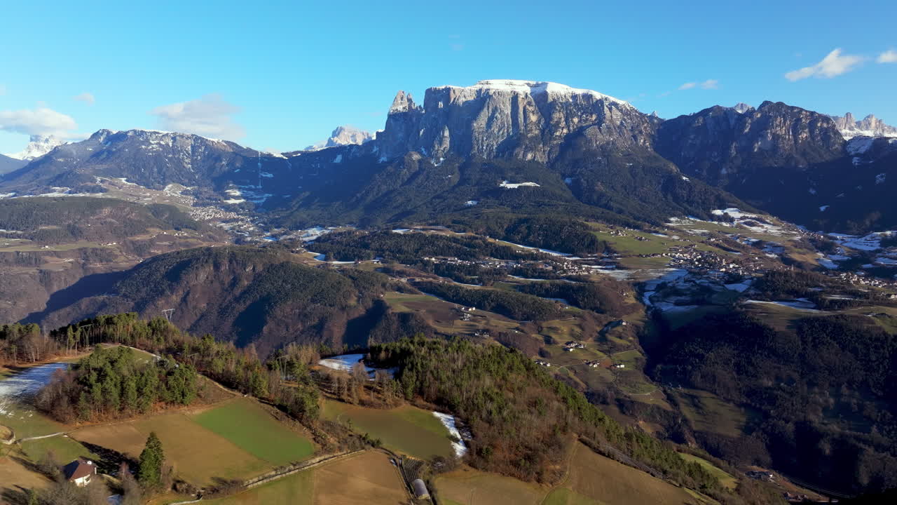 Aerial drone view of the Soprabolzano village on the Renon plateau in the Dolomites, Italy