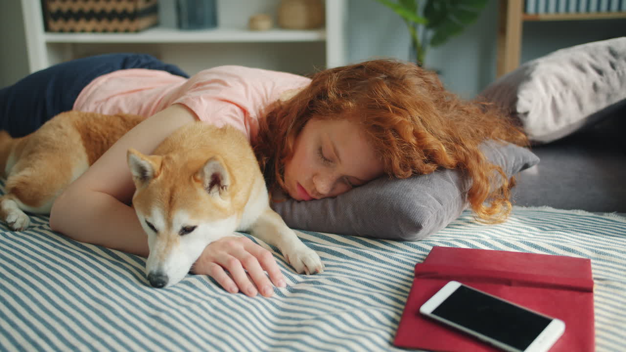 Girl Sleeping on Bed with Dog