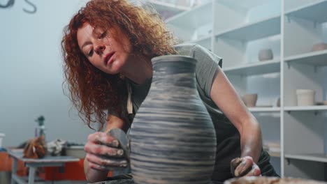 woman creating a ceramic vase