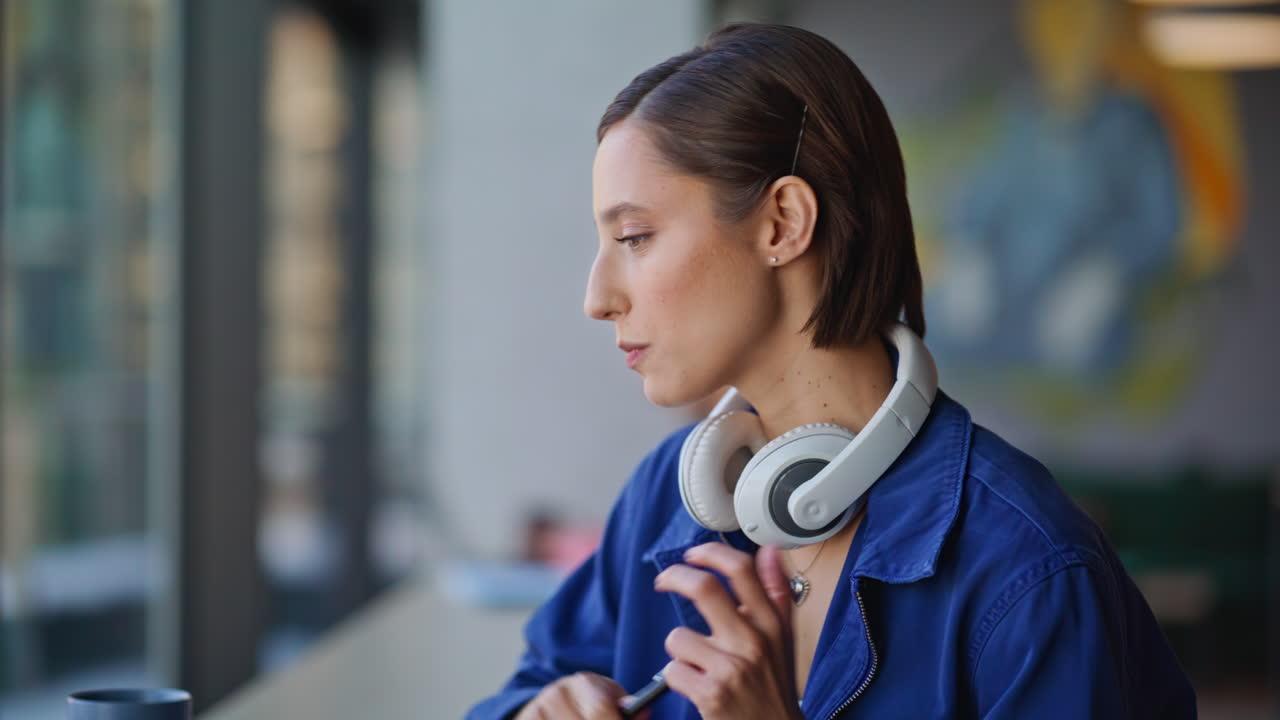 Online teacher talking computer web camera explaining material in office closeup
