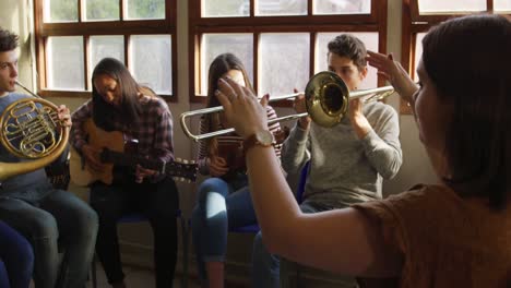 teenage musicians rehearsing