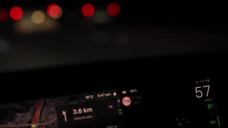 car driving at night with gps display