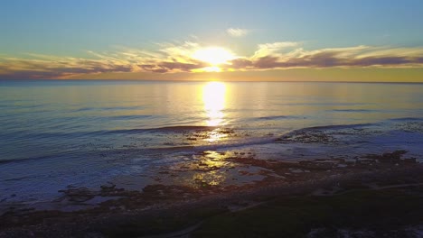 aerial view of sunset at a rocky beach in south africa