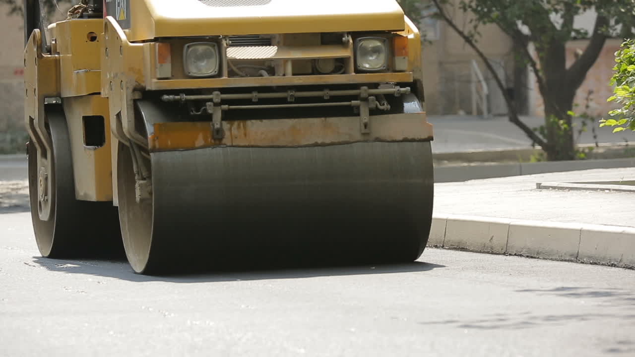 Road Roller Laying A New Asphalt. Road roller building the new asphalt road