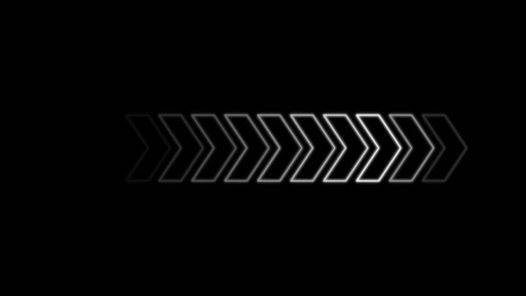 Outlined white arrow moves smoothly rightward, fading in and out, on a solid black background