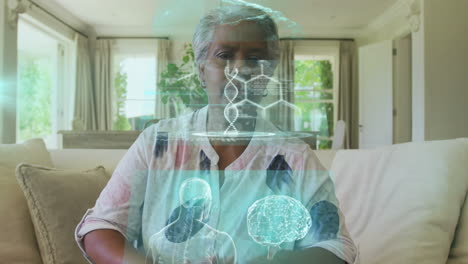 at home, elderly woman interacting with digital animation overlay showing data
