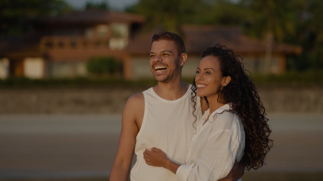 Romantic couple contemplating the sunset