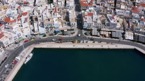 Aerial:-Slow-panoramic-reveal-drone-shot-of-Ermoupoli-city-in-Syros-island,-Greece-on-a-sunny-day