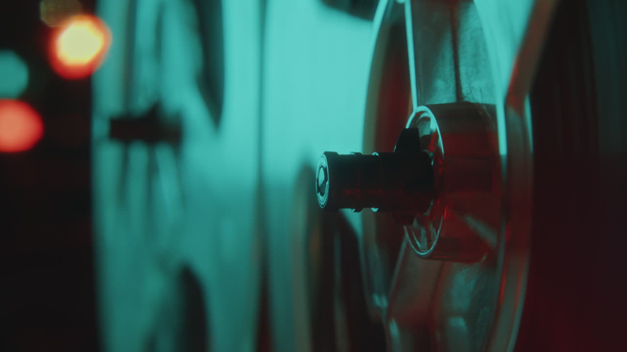 Close-Up View of Analog Reel-to-Reel Tape Recorder Playing Music