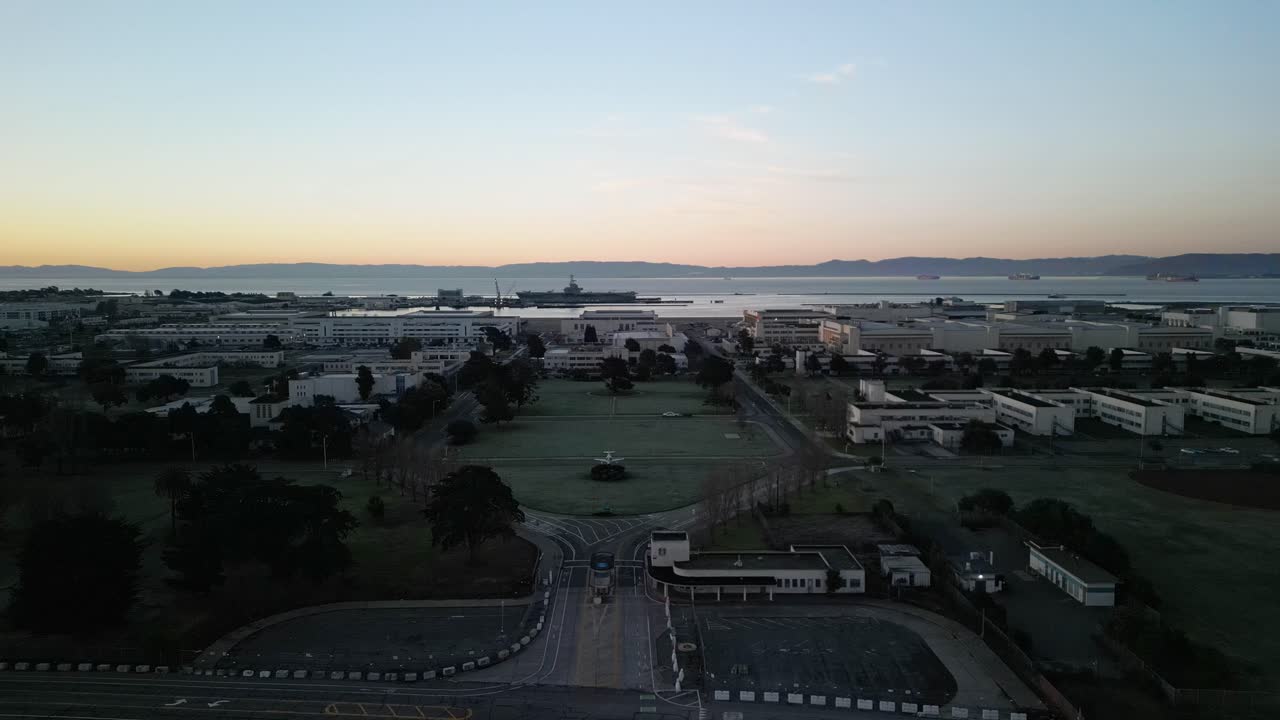 Static aerial drone view of West Alameda’s former naval station, highlighting old aircraft hangars and military infrastructure.