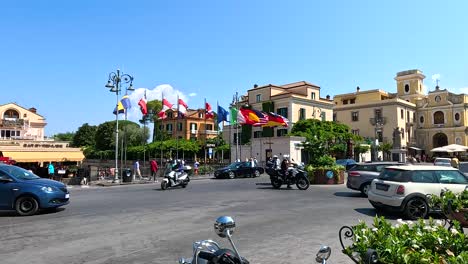 people and traffic in a bustling square