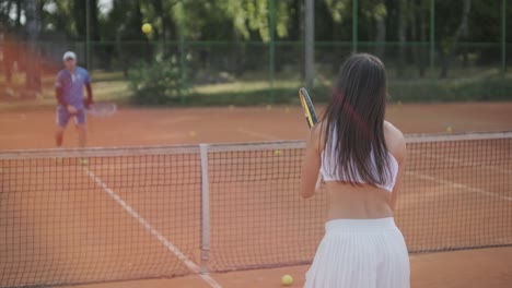 female tennis player practicing serve on outdoor court