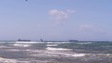 high jump of a kitesurf in slow motion during a windy day in slow motion