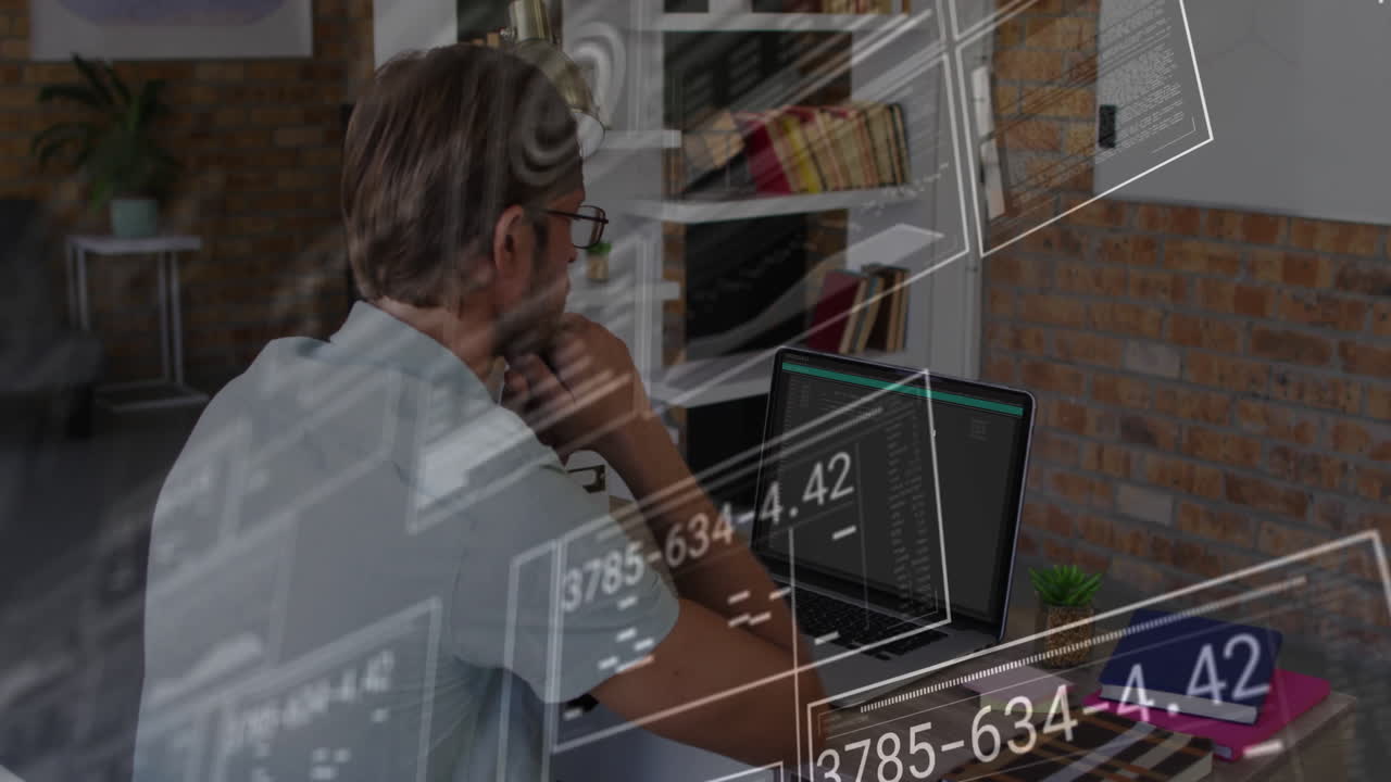 Man working on laptop with floating numerical data animation overlay