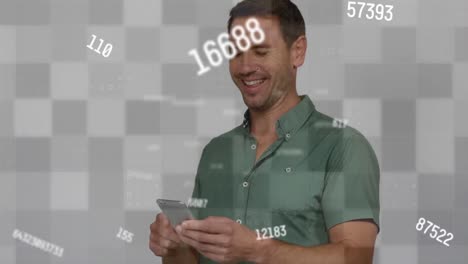 animation of multiple changing numbers over caucasian man using a smartphone against grey background