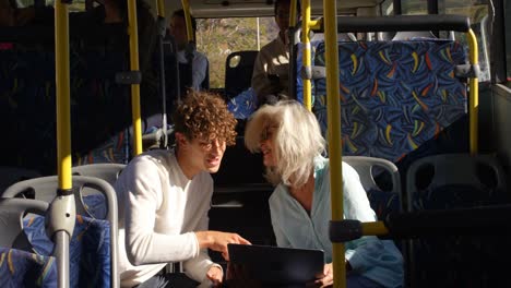 Commuters-using-laptop-while-travelling-in-bus-4k