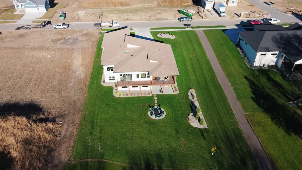 Drone footage of a new build mid century modern custom home in Iowa