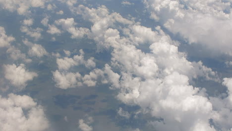 a window seat view from a charter flight from or tambo international airport from cruising altitude of 33000ft through high cumulonimbus cloud formations