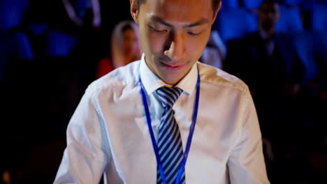 young asian businessman using digital tablet during business seminar in auditorium 4k