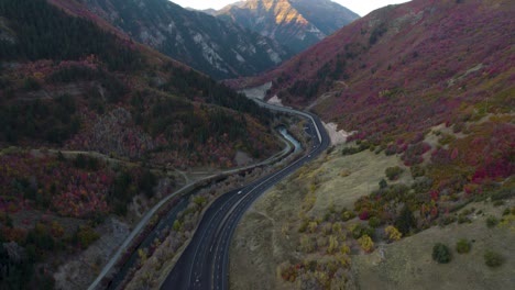 provo canyon mountain road with beautiful fall colors - aerial tilt-up