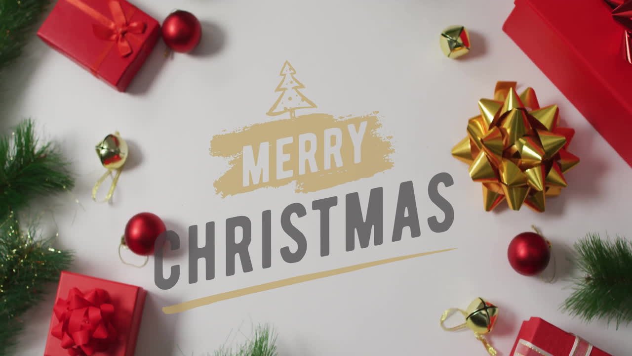 Merry Christmas text animation over festive decorations with gifts and ornaments