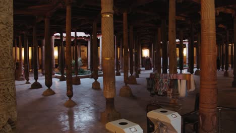 interior of a historical building with wooden pillars